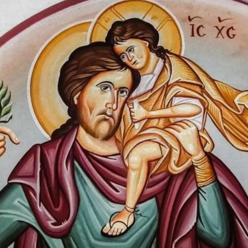 Homem barbado com auréola carrega uma criança com auréola no ombro; texto "IC XC".